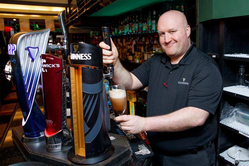 Bartender Trevor Kelly poured a perfect glass of Guinness at Megan’s Bar + Kitchen as people began getting in the Irish mood on Wednesday.