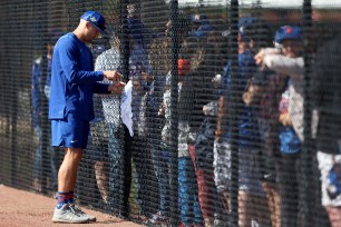 Brandon Nimmo signs autographs or fans during a recent Mets practice at Clover Park.