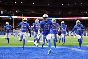 Detroit Lions celebrates after an interception against the Green Bay Packers.