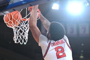 Julian Champagnie, who scored a game-high 26 points, slams one home during St. John's 92-73 win over DePaul.