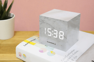A gray marble alarm clock block