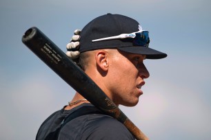 New York Yankees outfielder Aaron Judge waits to take batting practice for the team's spring training baseball game against the Toronto Blue Jays in Tampa, Fla., Wednesday, March 30, 2022.