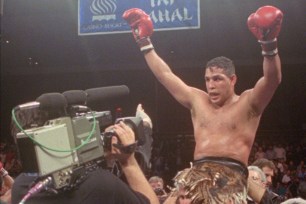 Hector "Macho" Camacho being lifted into the air after his unanimous decision over Roberto Duran in an IBC middleweight title