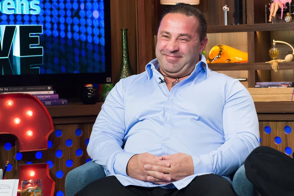 Joe Giudice smiles on WWHL.