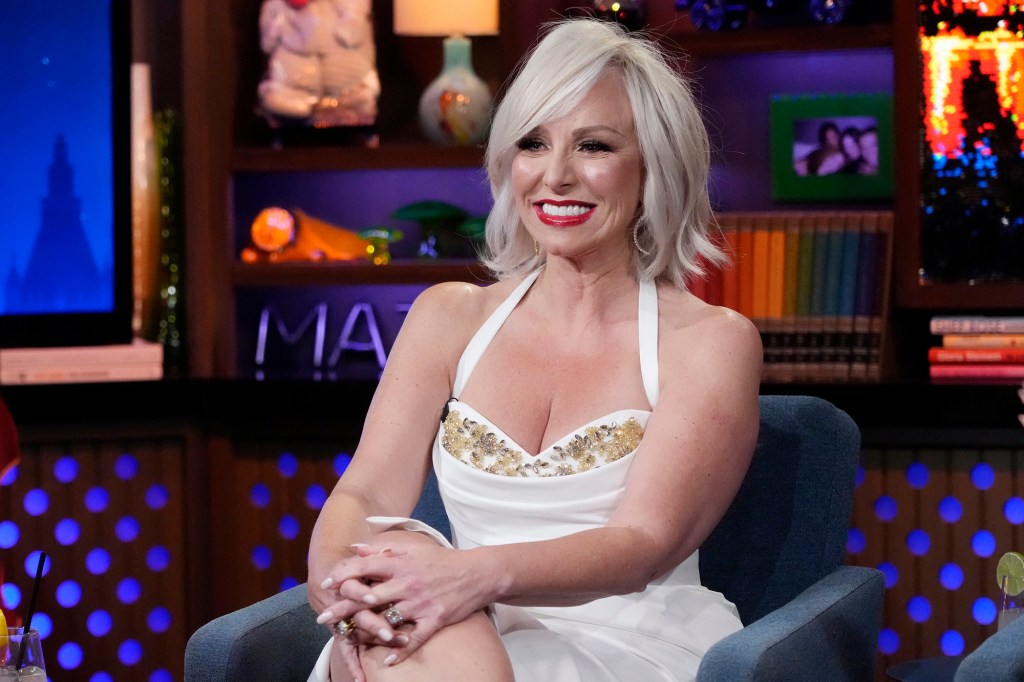 Margaret Josephs in a white halter dress.