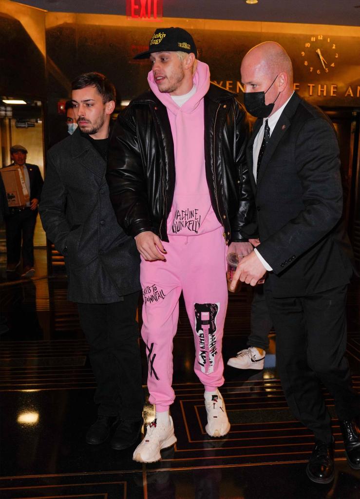 Pete Davidson in a pink sweatsuit.