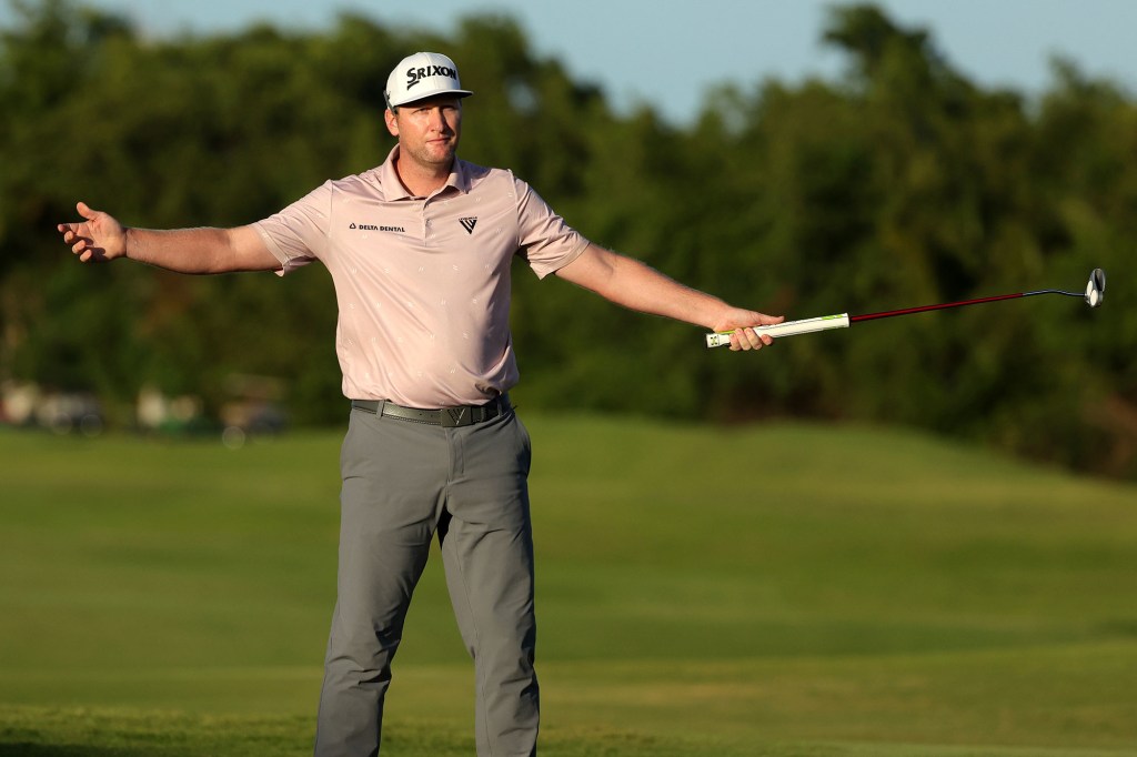 Ryan Brehm reacts after putting in to win on the 18th green 