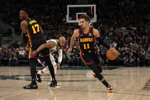 Trae Young of the Atlanta Hawks dribbles the ball.