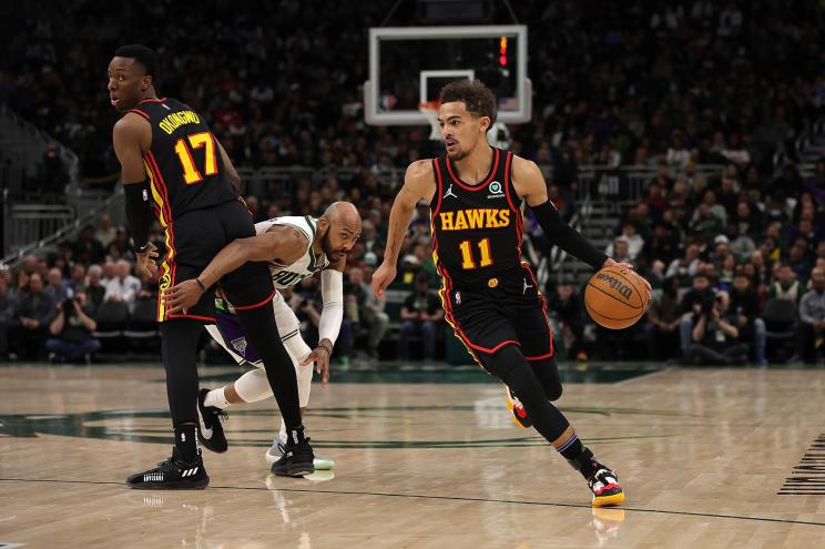 Trae Young of the Atlanta Hawks dribbles the ball.