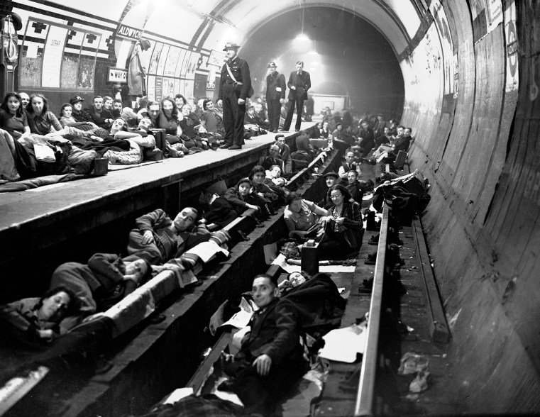 Londoners sleep on the platform and on the train tracks at Aldwych Underground station, London, during heavy all night Nazi bombing raids, Oct. 8, 1940.