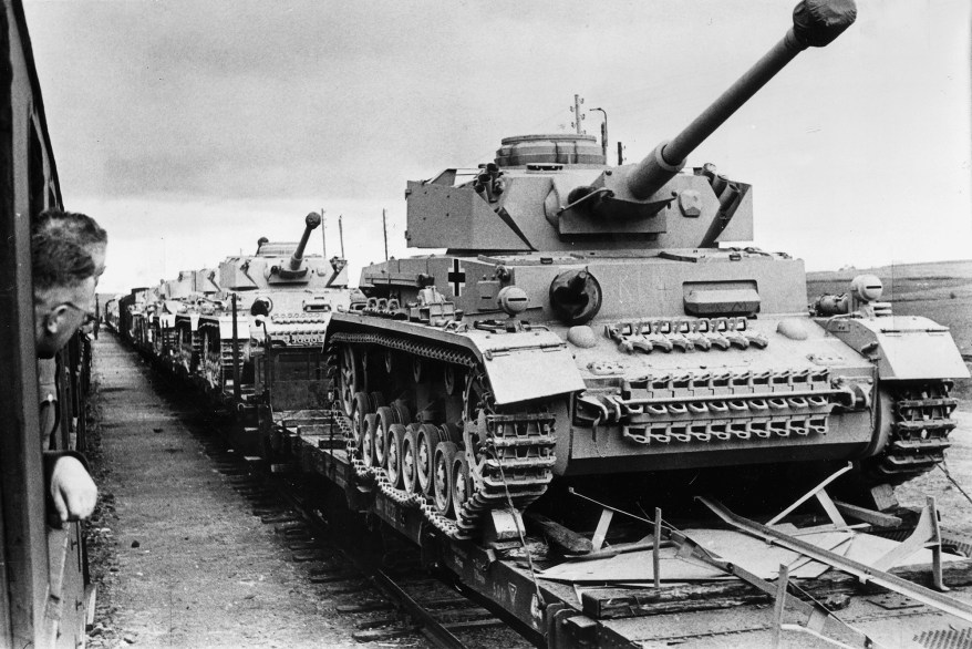 German railroad low loaders with brand new tanks on the way to the Eastern front, 1943.