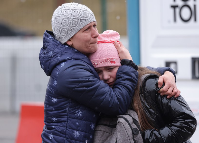 A mother and daughter fleeing war-torn Ukraine wait to cross into Poland at the Korczowa crossing on March 2.