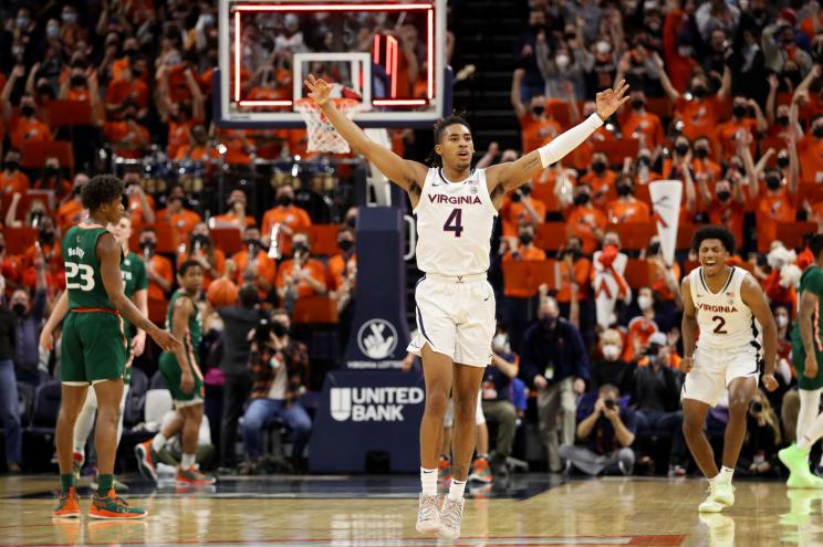 Armaan Franklin #4 of the Virginia Cavaliers celebrates a three-point shot to end the first half during a game against the Miami Hurricanes