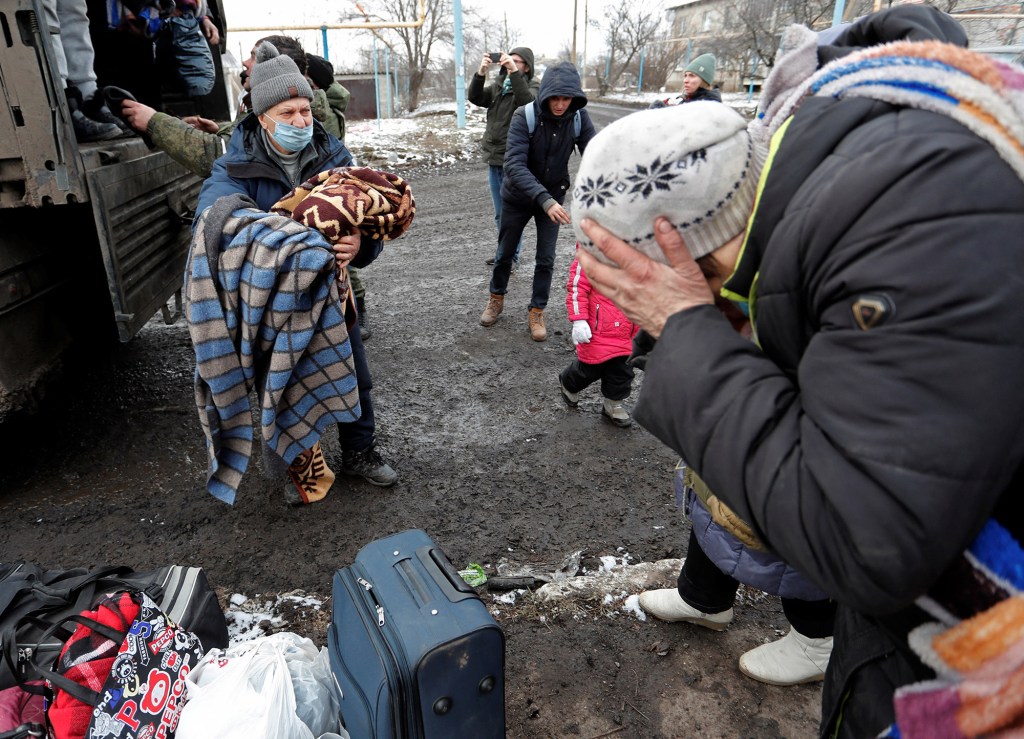 Civilians evacuated from Volnovakha arrive in the separatist-controlled village of Bugas.