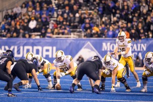Wyoming Cowboys quarterback Levi Williams (15) ready for the snap during a college football game between the Wyoming Cowboys and the Boise State Broncos.