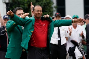 Tiger Woods eventually came back to his former form when he won the Masters in 2019 -- a 14-year gap from when he previously won the tournament in 2005. Patrick Reed helped Tiger Woods put on his fifth green jacket after Woods won the tourney in Augusta.