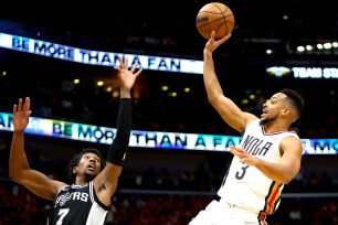 CJ McCollum, who scored 32 points, shoots a runner during the Pelicans' 113-103 win over the Spurs.