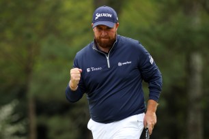 Shane Lowry of Ireland reacts after making par on the 14th green during the second round of The Masters at Augusta National Golf Club on April 8, 2022 in Augusta, Georgia.