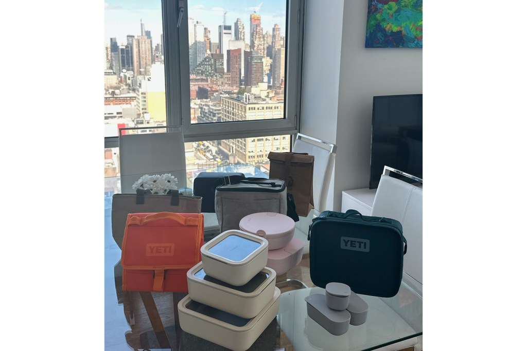 A group of lunch boxes displayed on a table