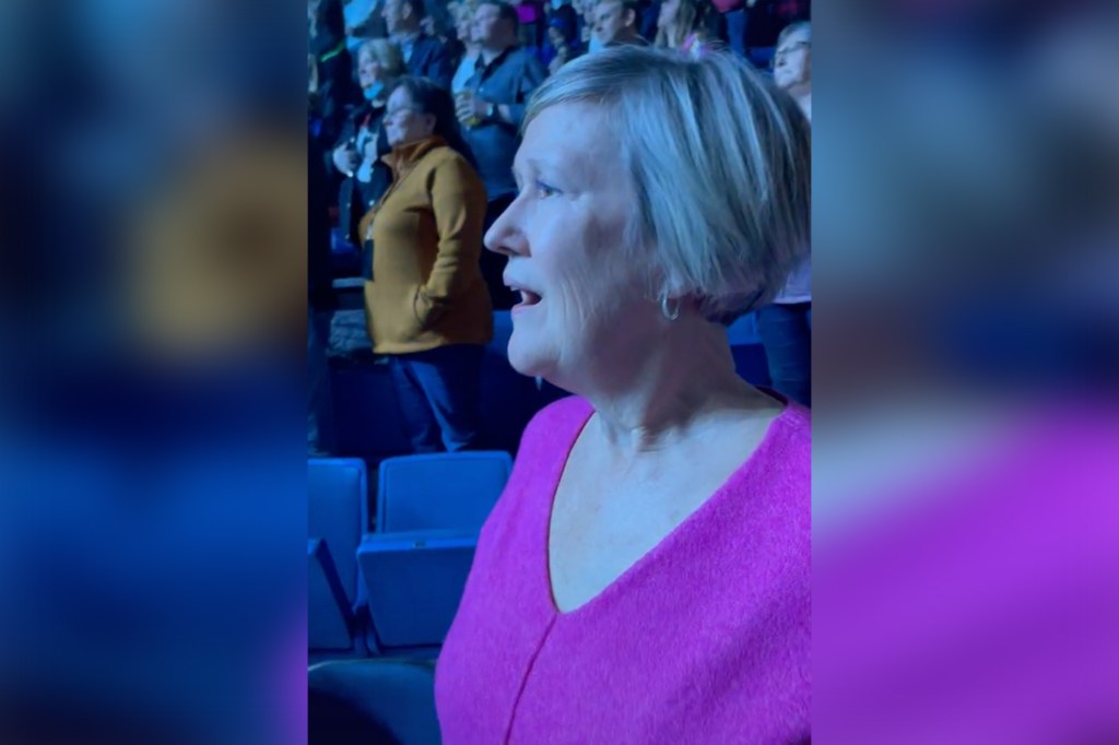 The video shows a mom in "complete euphoria" as she waits with her daughter for Elton John to step out on stage. 