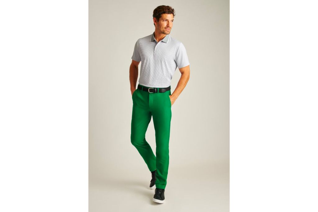 Man in green dress pants and tee shirt.