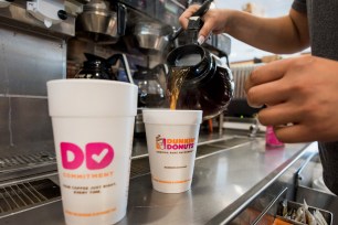 An employee fills a coffee order at a Dunkin' Donuts Inc. location in Ramsey, New Jersey.