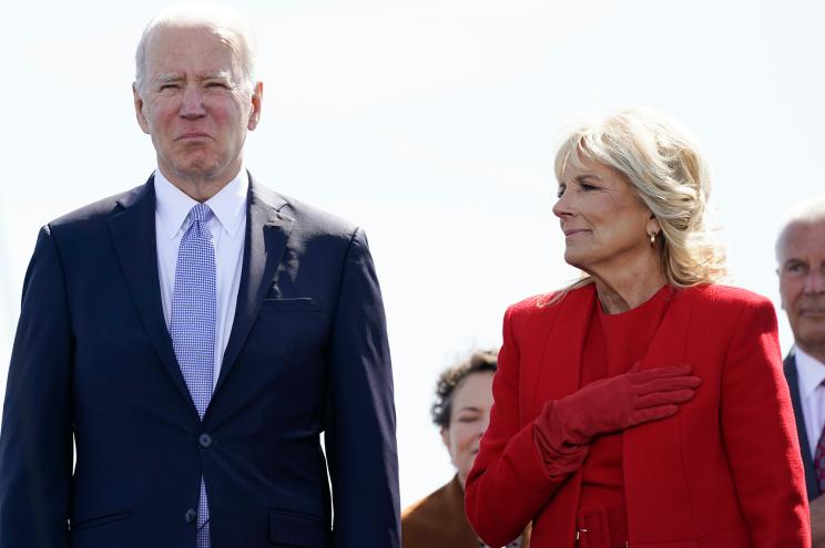 President Joe Biden and first lady Jill Biden stand during a commissioning ceremony for USS Delaware, Virginia-class fast-attack submarine, at the Port of Wilmington in Wilmington, Del., Saturday, April 2, 2022.