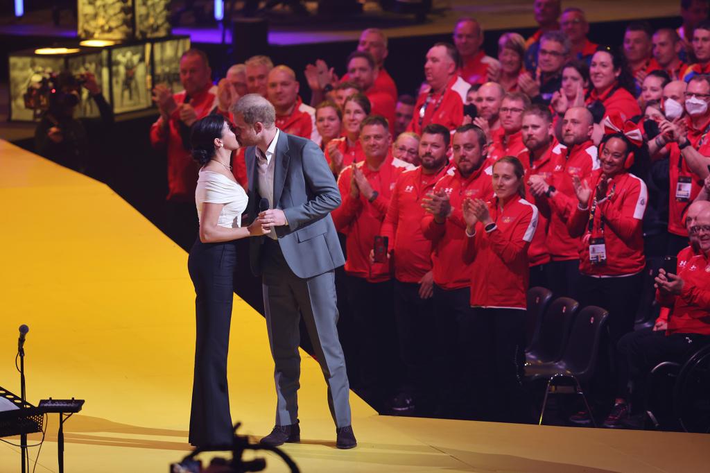 Meghan, Duchess of Sussex and Prince Harry, Duke of Sussex appear on stage during the Invictus Games.