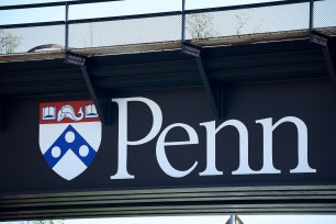 A university logo adorns a railroad bridge on the campus of the University of Pennsylvania in Philadelphia, Pennsylvania, U.S., September 25, 2017.
