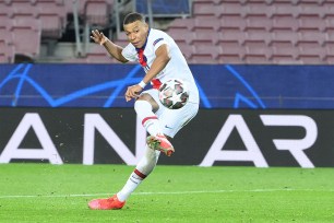 Paris Saint-Germain's Kylian Mbappe scores during the UEFA Champions League round of 16 first leg match against FC Barcelona in February.