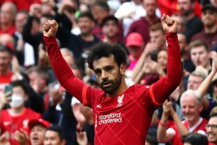 LIVERPOOL, ENGLAND - MAY 22: Mohamed Salah of Liverpool celebrates scoring his side's second goal during the Premier League match between Liverpool and Wolverhampton Wanderers at Anfield on May 22, 2022 in Liverpool, England. (Photo by Chris Brunskill/Fantasista/Getty Images)