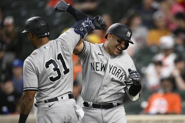 Jose Trevino, right, celebrates after his three-run home run.