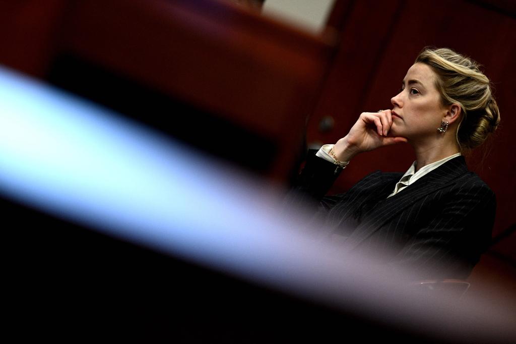 US actress Amber Heard looks on in the courtroom at the Fairfax County Circuit Courthouse.