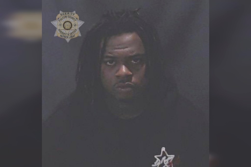 Rapper Gunna, whose real name is Sergio Kitchens, was booked into a jail in Atlanta on a racketeering charge Wednesday.