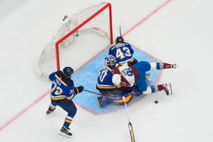 Nazem Kadri collides with Jordan Binnington.