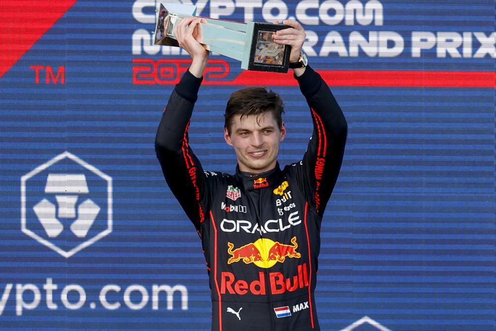 Max Verstappen of Red Bull Racing receives a trophy on the podium after winning F1's Miami Grand Prix on Sunday, May 8. 2022