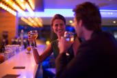 Couple drinking wine in a hotel bar