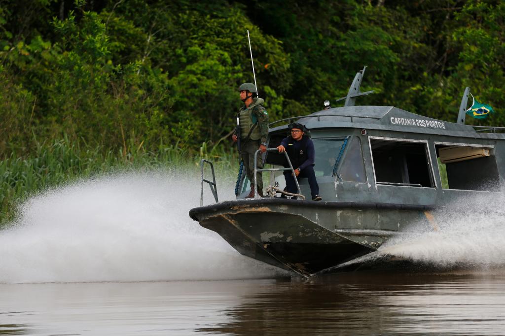 Navy sailors search for Dom Phillips and Bruno Pereira on a speedboat in the Javari Valley Indigenous of Brazil, on June 9, 2022.