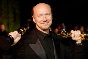 "Crash" writer/director Paul Haggis holds up his two Oscars