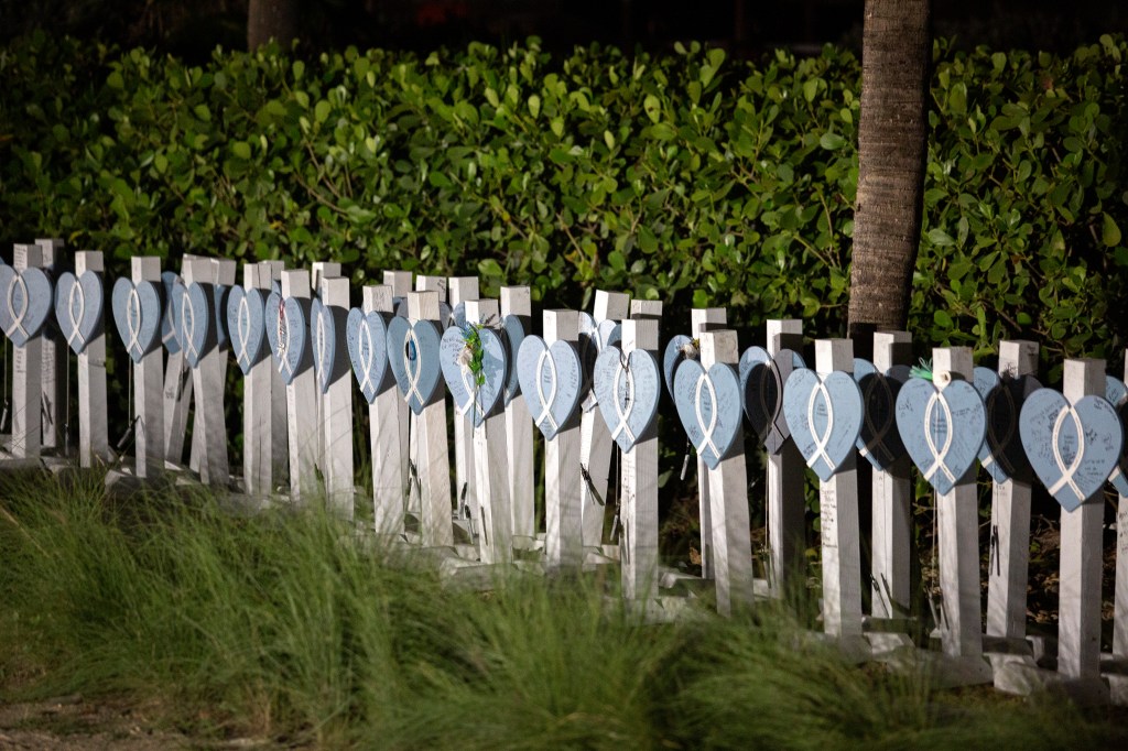 A view of memorial poles are placed at the site of the former Champlain Towers South building in Surfside, Florida, on June 24, 2022.