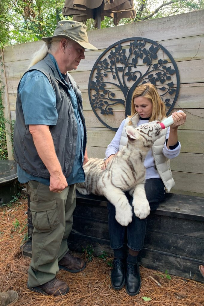 Myrtle Beach, SC- Mariana van Zeller holds a tiger cub and talks with Myrtle Beach Safari founder Bhagavan "Doc" Antle.