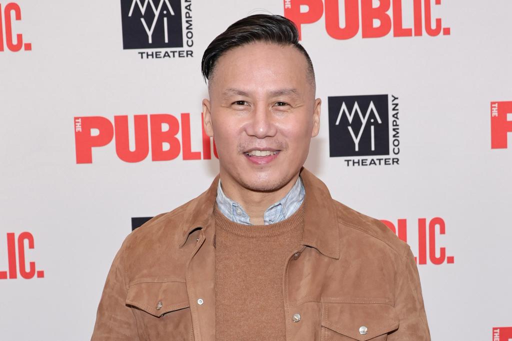 BD Wong in a tan jacket. 