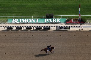 Triple Crown and Belmont Stakes contender Justify trains with Humberto Gomez up prior to the 150th running of the Belmont Stakes.