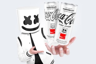 DJ Marshmello holding cans of his new Coca-Cola limited edition collaboration.