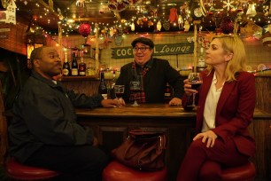 Casey Washington, Lou Mustillo and Rhea Seehorn in a scene from "Cooper's Bar." They're sitting at the Casey and Rhea are seated at the Tiki Bar and Lou is behind the counter. He's wearing a jacket and a scarf.