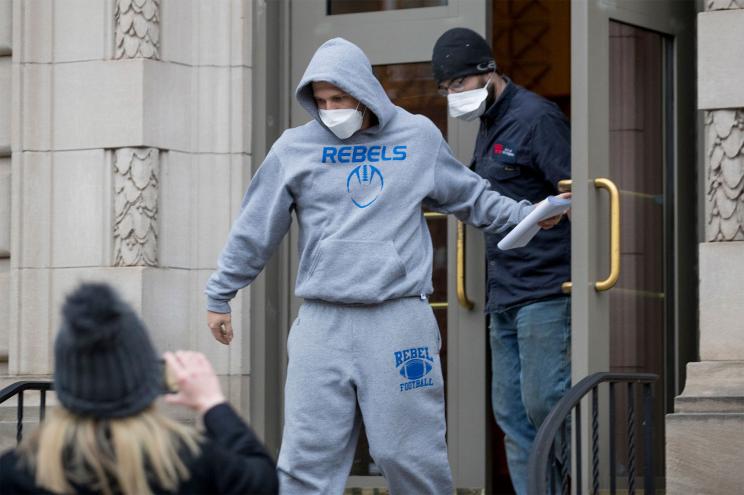 FILE - Derrick Evans exits the Sidney L. Christie U.S. Courthouse and Federal Building after being arraigned, Jan. 8, 2021, in Huntington, W.Va. The former West Virginia lawmaker who livestreamed himself on Facebook storming the U.S. Capitol and cheering on what he described as a “revolution” has been sentenced to three months in prison. (Sholten Singer/The Herald-Dispatch via AP)