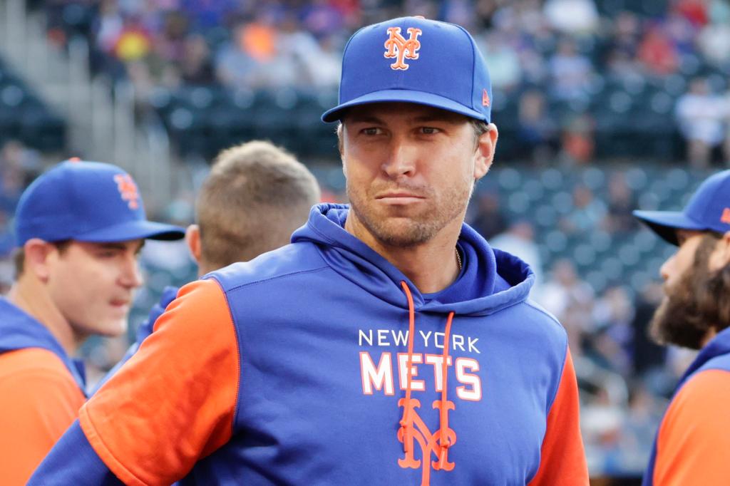 New York Mets ace Jacob DeGrom mills about on the field before an MLB game against the Philadelphia Phillies, Saturday, May 28, 2022.