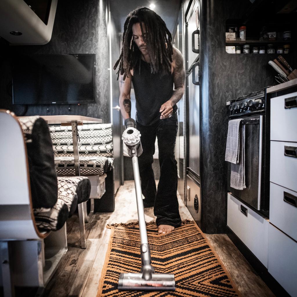 Lenny Kravitz in the kitchen and dining space of his trailer.