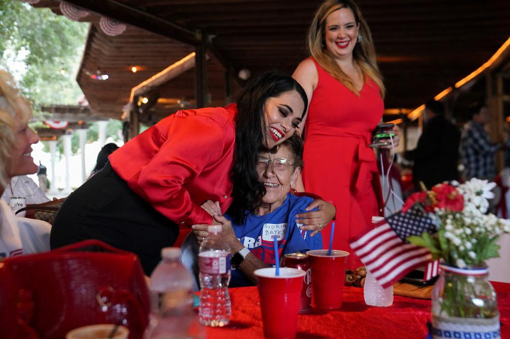 Republican Mayra Flores, who is running for the vacant 34th congressional district seat, is greeted by a woman during her watch party in San Benito, Texas.