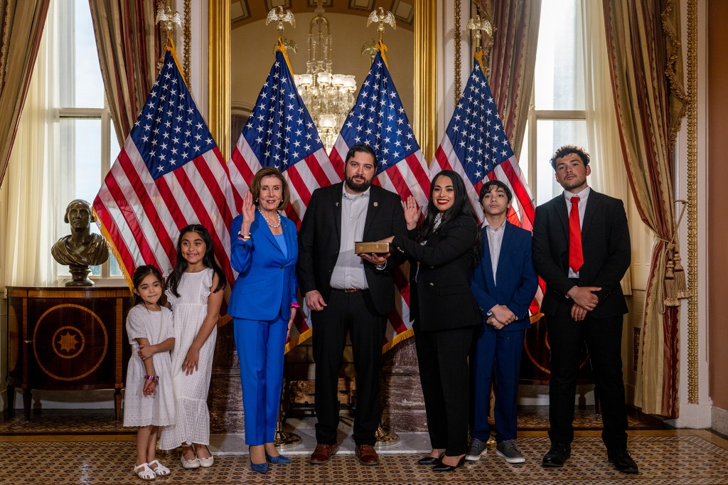 Congresswoman Mayra Flores with her family and Speaker of the House Nancy Pelosi  after being sworn-in. Flores immigrated to Texas as a child and believes that the American Dream is attainable by everyone. 